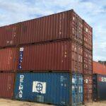 stack of used 20 foot standard shipping container