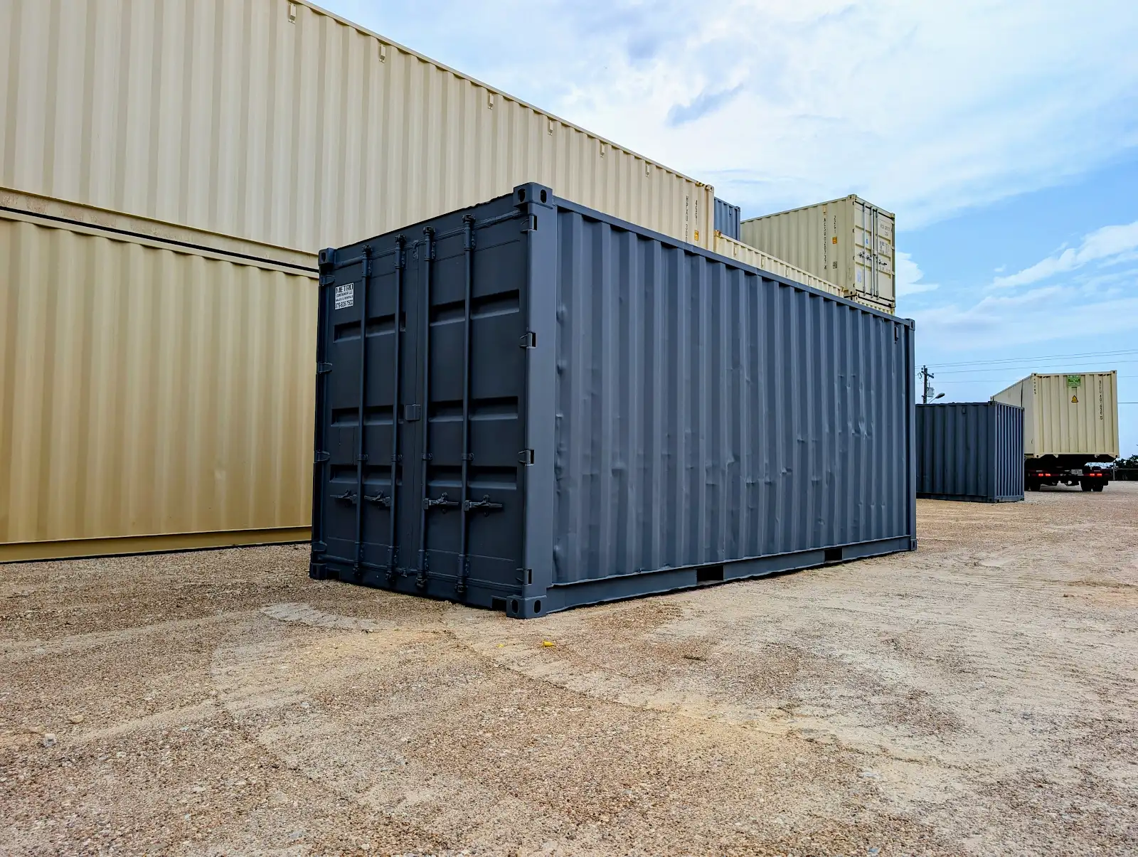 Front corner view of dark gray refurbished storage container