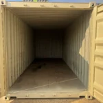 Interior of 20 foot refurbished container with wood floor and open doors