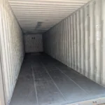 Interior of 40 foot refurbished container with wood floor and open doors